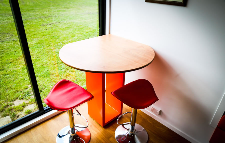 dining area red stools beech table