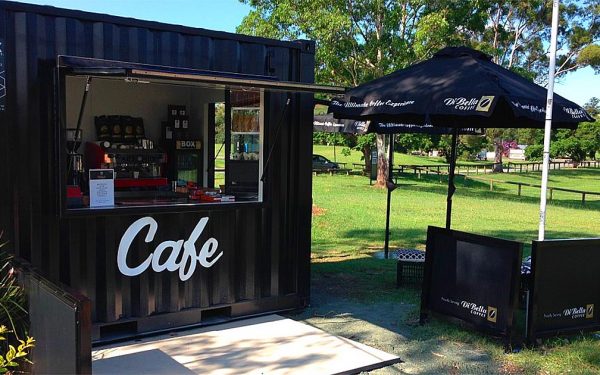 black shipping container pop up cafe