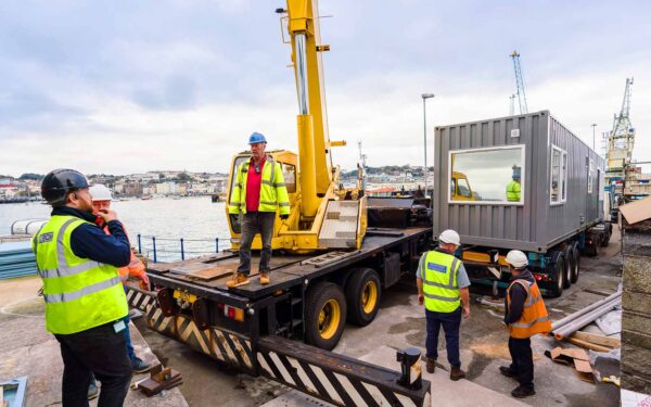 guernsey harbours crane off loading container