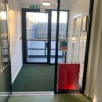 inside view sliding frameless glass entrance lobby glass door