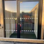 outside sliding frameless glass entrance lobby glass door