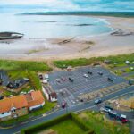 beadnell bay beach aerial photo