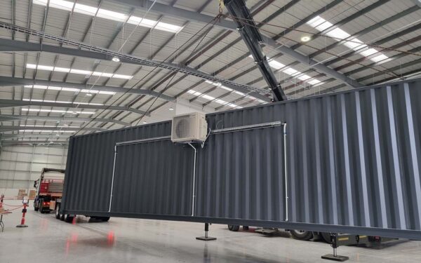 grey shipping -container crane large factory