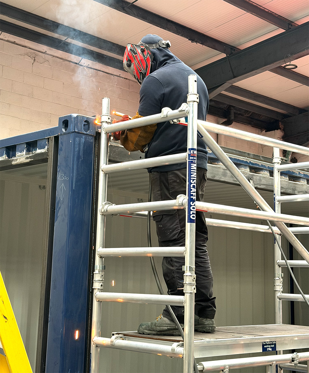 Welding roof section switch house container build