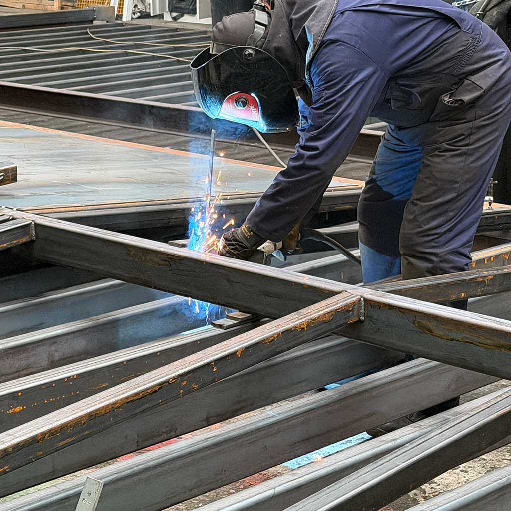 Switch house welding pitched roof steel bars