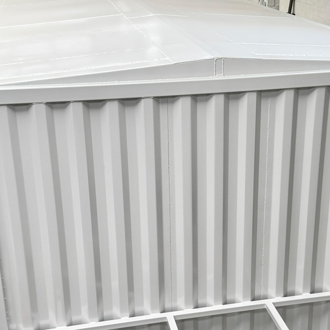 Switch house container build roof pitched and coated white paint